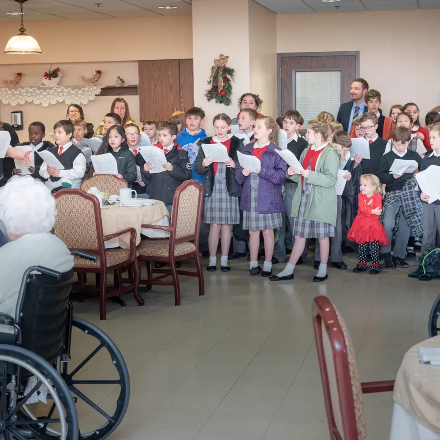 Students singing together in service to the community